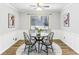 Dining area featuring a round table, four chairs, and a window view at 763 Windy Sw Dr, Stone Mountain, GA 30087