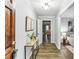 Bright and airy foyer with wood-look floors and a console table at 763 Windy Sw Dr, Stone Mountain, GA 30087