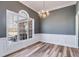 Formal dining room with wainscoting and hardwood floors at 9415 Grande Dr, Winston, GA 30187