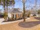 Charming brick home featuring meticulous landscaping and a winding driveway at 9415 Grande Dr, Winston, GA 30187