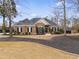 Lovely brick home boasting mature trees, manicured landscaping, and inviting curb appeal at 9415 Grande Dr, Winston, GA 30187