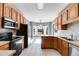 Kitchen with wood cabinets and modern appliances at 9415 Grande Dr, Winston, GA 30187