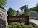 Westside Park entrance with signage, landscaping and a modern white walkway in the background at 1686 Gunnin Nw Trce # 249, Atlanta, GA 30318