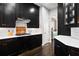 Modern kitchen with dark cabinetry and white countertops at 1918 Saxon Valley Ne Cir, Brookhaven, GA 30319