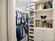 Large walk-in closet with custom shelving and drawers at 1918 Saxon Valley Ne Cir, Brookhaven, GA 30319