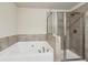 Bathroom with garden tub and walk-in shower at 2084 Wheylon Dr, Lawrenceville, GA 30044