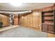 Unfinished basement area with wood paneling and shelving at 2907 Renfro Nw Dr, Atlanta, GA 30318