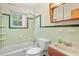 Clean bathroom with green tile and shower/tub combo at 2907 Renfro Nw Dr, Atlanta, GA 30318