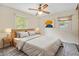 Bright bedroom with hardwood floors, a ceiling fan, and large windows at 2907 Renfro Nw Dr, Atlanta, GA 30318