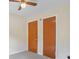 Bedroom featuring ceiling fan and wood closet doors at 2907 Renfro Drive Nw Dr, Atlanta, GA 30318