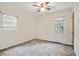 Spacious bedroom with ceiling fan and large window at 2907 Renfro Nw Dr, Atlanta, GA 30318