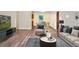 Living room with hardwood floors, stylish furniture, and views to the kitchen at 2907 Renfro Nw Dr, Atlanta, GA 30318