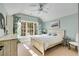 Bedroom with a queen-size bed, large windows, and light-colored walls at 3268 Teton Se Dr, Atlanta, GA 30339