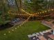 Spacious backyard with string lights, deck, and patio at 5735 Winterthur Ln, Atlanta, GA 30328