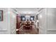 Formal dining room with dark hardwood floors, chandelier, and a large wooden table at 5735 Winterthur Ln, Atlanta, GA 30328