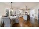 Bright breakfast nook area with hardwood floors and view to kitchen at 12265 Magnolia Crescent Dr, Roswell, GA 30075