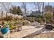 Brick patio with seating area, string lights and small table at 12265 Magnolia Crescent Dr, Roswell, GA 30075