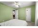 Bright bedroom with ceiling fan and access to another room at 2768 Hawk Trace Ne Ct, Marietta, GA 30066