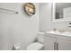 Clean bathroom with white vanity, toilet, and shower at 3970 Somerled Trl, Atlanta, GA 30349