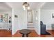 Bright entryway with hardwood floors, staircase, and coat closet at 3970 Somerled Trl, Atlanta, GA 30349