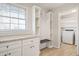 White cabinets, granite countertop and built-in shelving at 3970 Somerled Trl, Atlanta, GA 30349