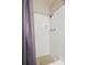 Shower stall with white tile surround and gray shower curtain at 3970 Somerled Trl, Atlanta, GA 30349