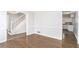 Dining room with hardwood floors and view of kitchen and staircase at 501 Fond Du Lac Dr, Stone Mountain, GA 30088