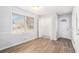 Spacious dining area with wood-look flooring and an adjacent kitchen at 501 Fond Du Lac Dr, Stone Mountain, GA 30088