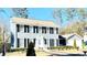 Two-story house with gray siding, black shutters, and landscaped yard at 501 Fond Du Lac Dr, Stone Mountain, GA 30088