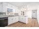 Modern kitchen with white cabinets, granite countertops, and stainless steel appliances at 501 Fond Du Lac Dr, Stone Mountain, GA 30088