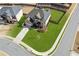 House nestled in a quiet residential neighborhood with a green lawn at 5110 Meridian Pass, Cumming, GA 30028