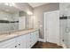 Double vanity bathroom with granite countertops and a large walk-in shower at 5110 Meridian Pass, Cumming, GA 30028