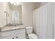 Bathroom with granite countertop and white cabinets at 5110 Meridian Pass, Cumming, GA 30028