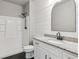 Bathroom with a shower/tub combo, granite vanity, and white cabinets at 5110 Meridian Pass, Cumming, GA 30028