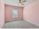 Pink bedroom with grey carpet and window at 5110 Meridian Pass, Cumming, GA 30028