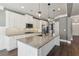 Large kitchen island with granite countertop and pendant lighting at 5110 Meridian Pass, Cumming, GA 30028