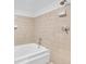 Bathroom featuring a soaking tub with tile surround at 572 Edgewood Ne Ave # 309, Atlanta, GA 30312