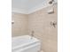 Clean bathroom with tiled walls and built in tub at 572 Edgewood Ne Ave # 309, Atlanta, GA 30312