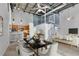 Open concept dining area with modern light fixtures and spiral staircase at 572 Edgewood Ne Ave # 309, Atlanta, GA 30312