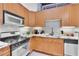 Modern kitchen with light wood cabinets and granite countertops at 572 Edgewood Ne Ave # 309, Atlanta, GA 30312