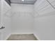 Spacious walk-in closet with metal shelving and concrete flooring at 572 Edgewood Ne Ave # 309, Atlanta, GA 30312