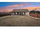 Backyard view at sunset featuring a covered patio and above ground pool at 7 Little Creek Manor Dr, Dallas, GA 30157