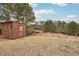 Backyard with shed and view of treeline at 7 Little Creek Manor Dr, Dallas, GA 30157