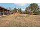 Backyard view of home, pool, and shed at 7 Little Creek Manor Dr, Dallas, GA 30157