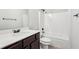 Clean bathroom with a shower/tub combo and dark vanity at 7 Little Creek Manor Dr, Dallas, GA 30157