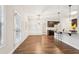 Bright dining room with hardwood floors and chandelier, adjacent to kitchen at 7 Little Creek Manor Dr, Dallas, GA 30157