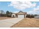 Ranch style home with stone accents and a two-car garage at 7 Little Creek Manor Dr, Dallas, GA 30157