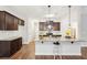 Spacious kitchen featuring an island and dark wood cabinets at 7 Little Creek Manor Dr, Dallas, GA 30157