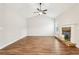 Living room with hardwood floors, stone fireplace and neutral walls at 7 Little Creek Manor Dr, Dallas, GA 30157