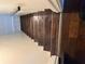 Dark-stained wooden staircase with tiled flooring at 3973 Woodland Se Cir, Conyers, GA 30013